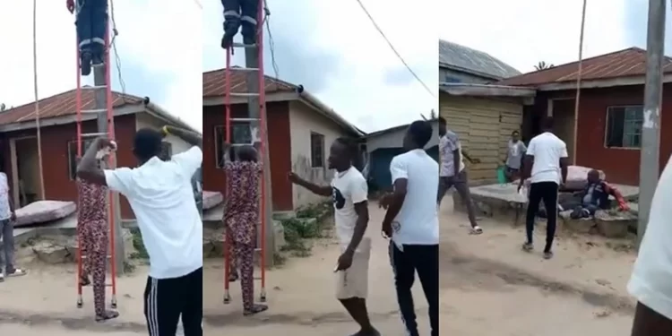 Electricity Company Worker Falls To The Ground As Residents Push His Ladder