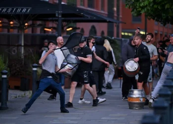 Protesters loot shops as UK riot worsens