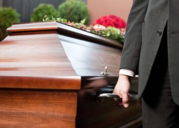 Horror as corpse falls out of hearse and into path of busy traffic in disturbing accident