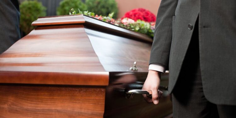 Horror as corpse falls out of hearse and into path of busy traffic in disturbing accident