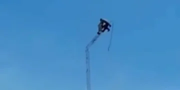 Horror moment transmission tower collapses with two workers strapped to the top sending them falling to their deaths